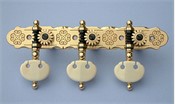L488: Rodgers style engraved brass decorative edge side plates, synthetic ivory kidney buttons