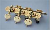 L490b: Rodgers style engraved brass decorative edge side plates, synthetic ivory kidney buttons, cream colored rollers with self-aligning bearing bushes