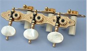 L112: Hauser style engraved brass side plates, light mop oval buttons, cream colored rollers