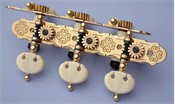 L488: Rodgers style engraved brass decorative edge side plates, synthetic ivory kidney buttons, cream colored rollers with self aligning bearing bushes