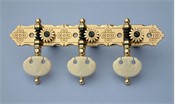 L490a: Rodgers style engraved brass decorative edge side plates, synthetic ivory kidney buttons