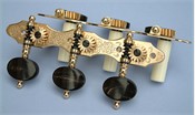 L302: Hauser style engraved brass side plates, black horn oval buttons, cream colored rollers