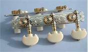 L640b: Baker style engraved sterling silver side plates with reverse gearing, bright steel worms, low profile pips, cream colored rollers, synthetic ivory traditional buttons